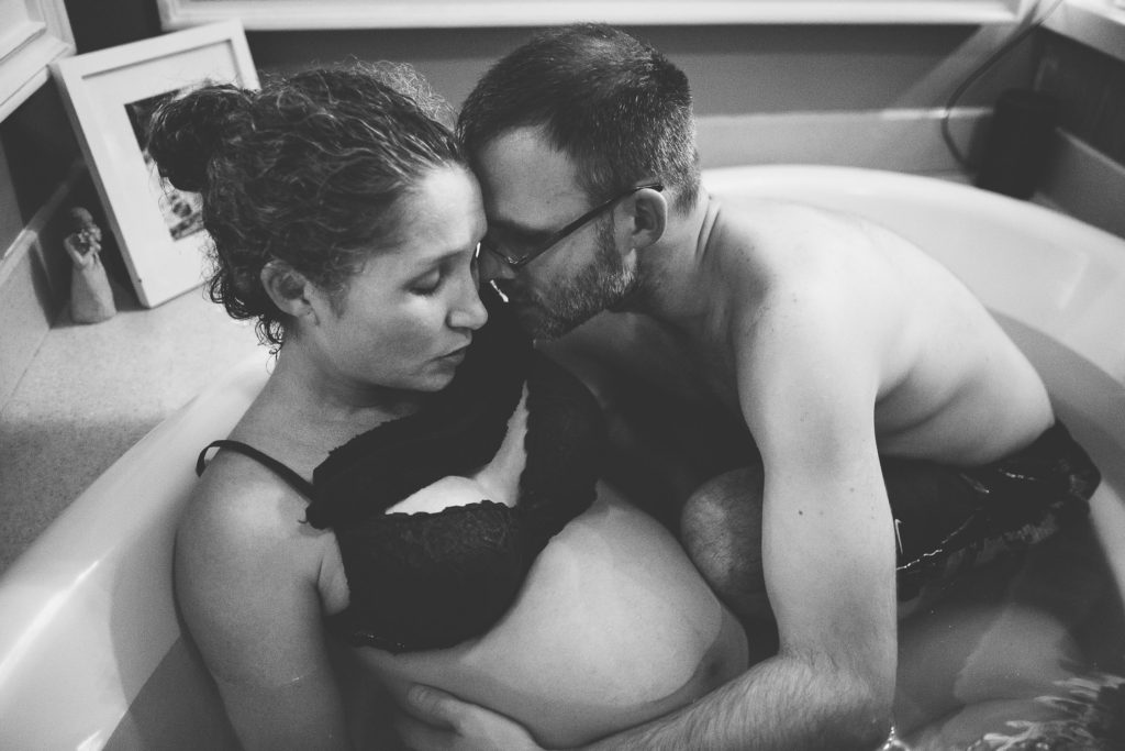 dad helping mom during labor Albany NY home birth photography