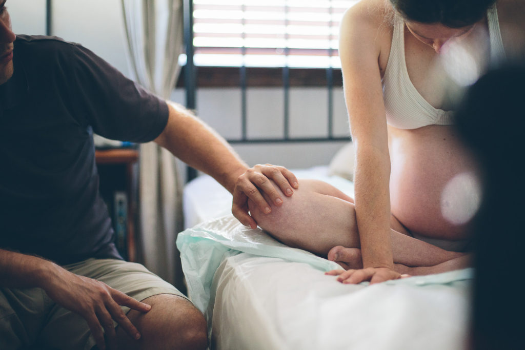 mom laboring during home birth Glenville NY birth photographer