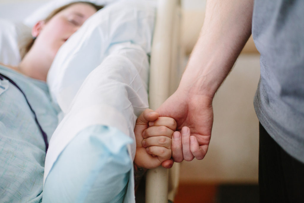 partners holding hands during labor Burdett Birth Center Troy NY