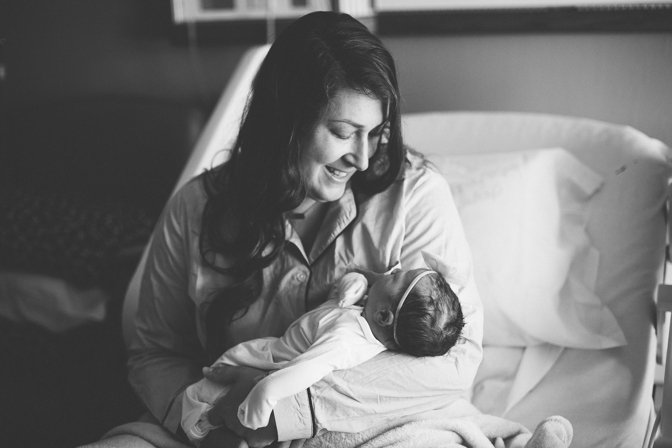 mom holding newborn baby girl Saratoga NY fresh 48 photographer