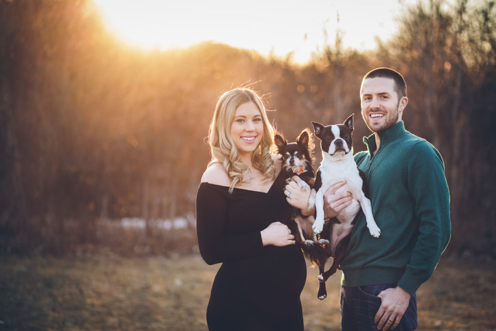 family holding two dogs at sunset Clifton Park Family photographer