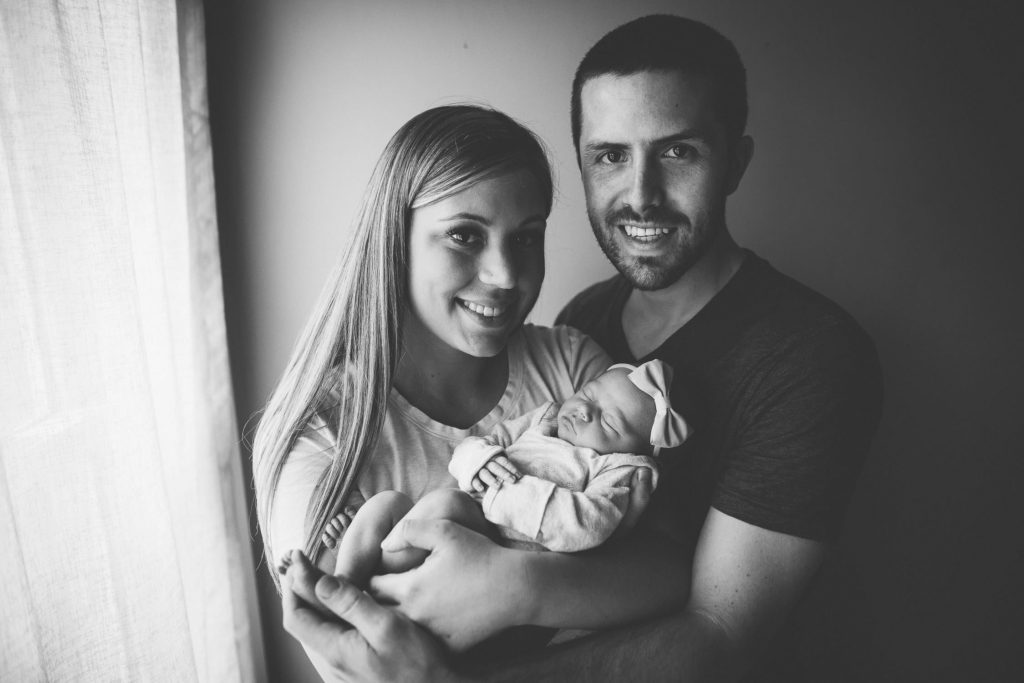 black and white photography family of three lifestyle newborn