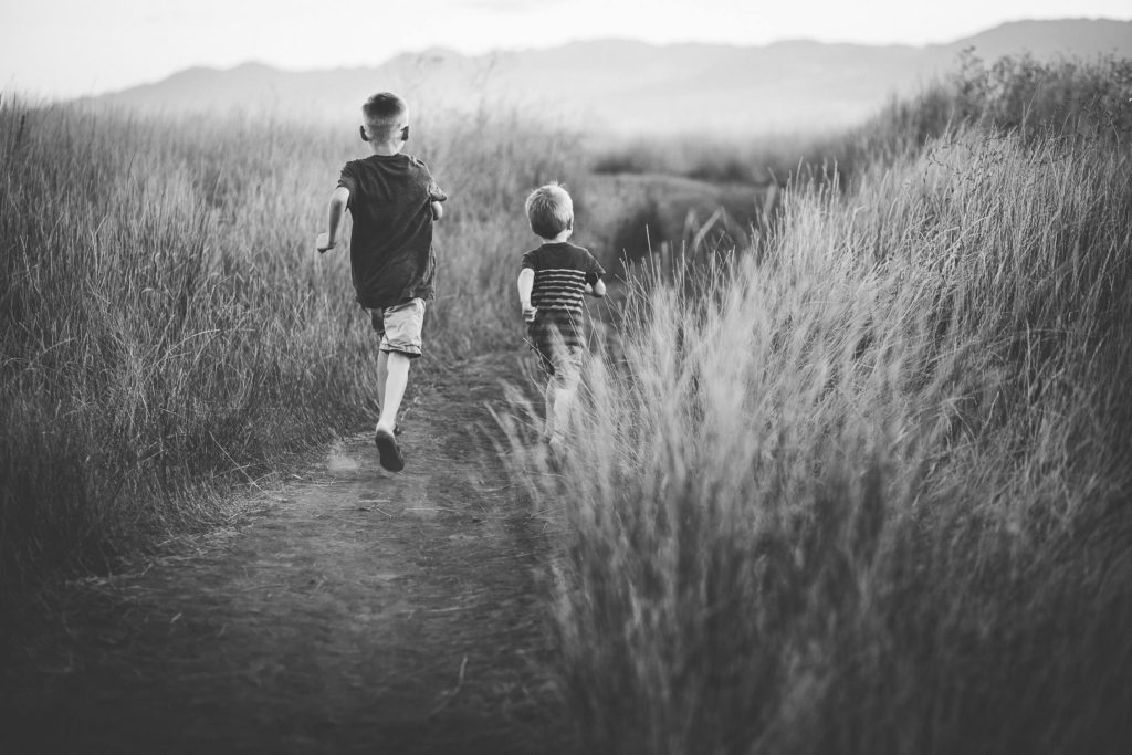 Boys running on a trail Capital Region NY lifestyle photographer