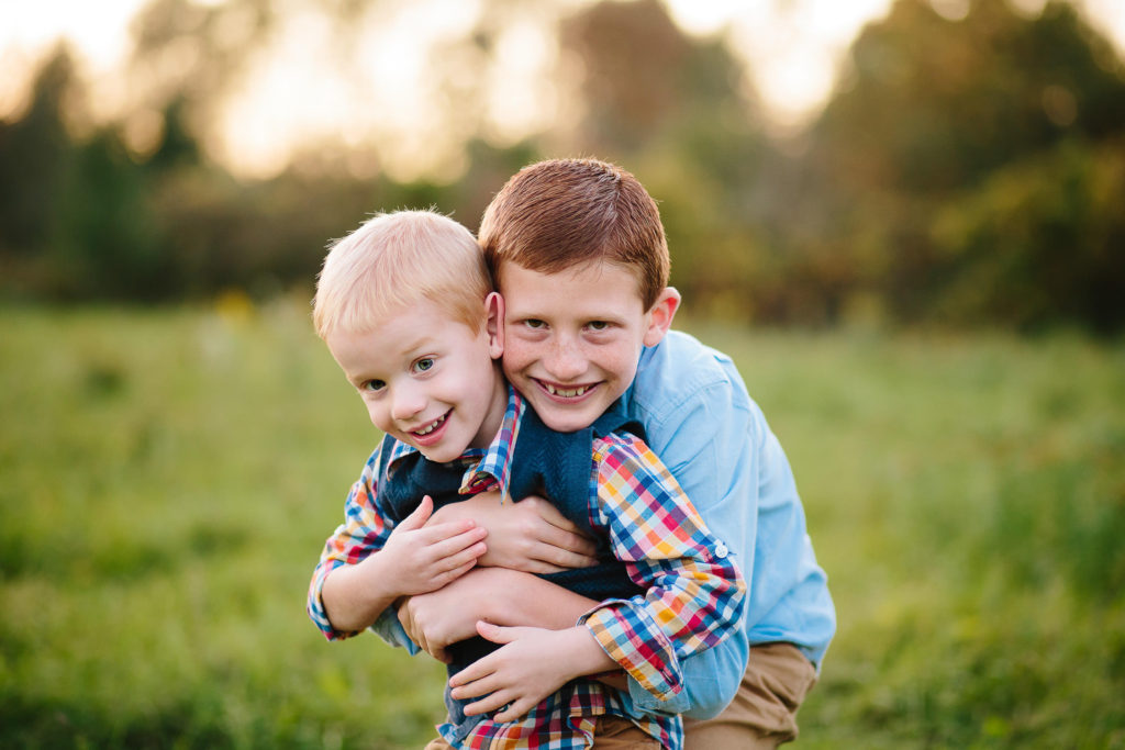brothers hugging at garnsey park in Clifton park NY