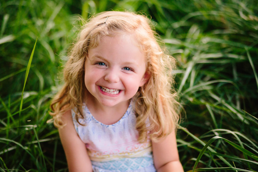 Saratoga New York Child photographer little girl with blond hair in grass
