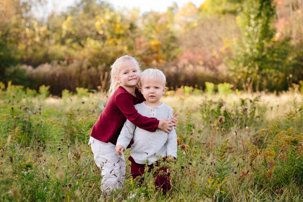 sister hugging baby brother Clifton park New York Family photographer