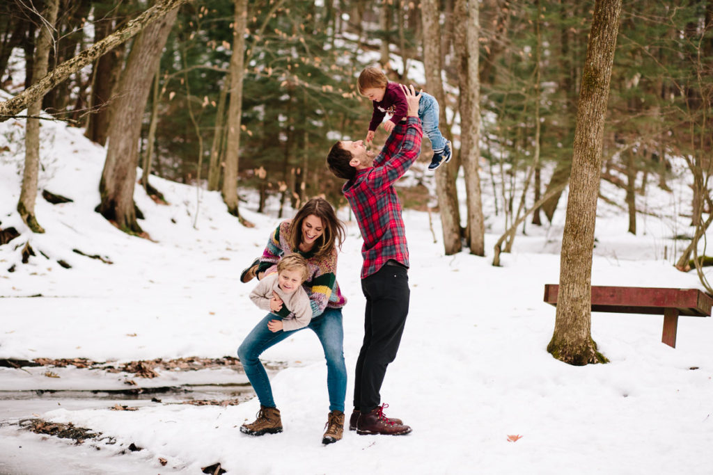 Parents playing with sons at Kinns Road in Clifton Park New York