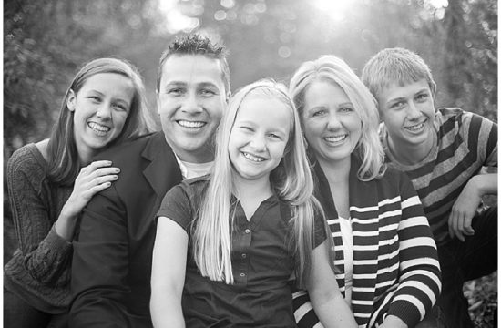 Family of five in family photo in the park