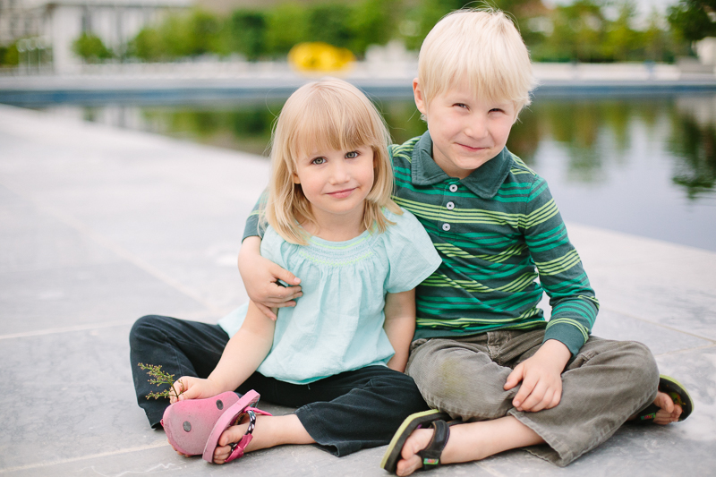 Siblings sitting at Empire State Plaza Albany