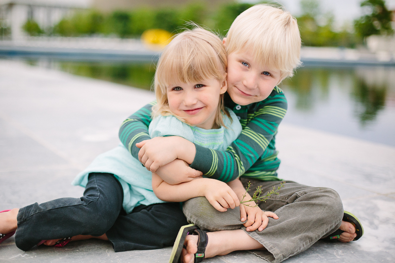 Brother hugging sister 