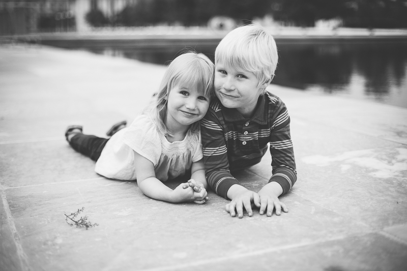 Siblings lying on tummy looking up