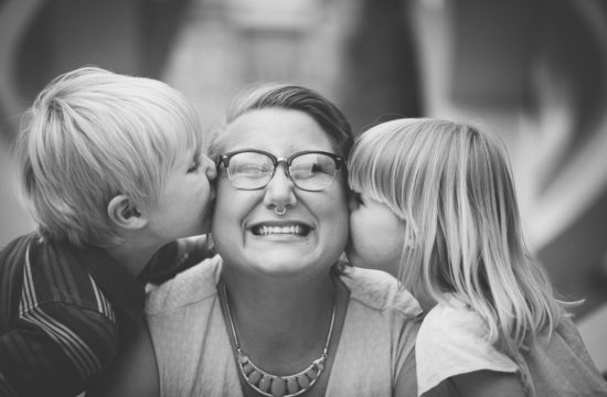 Kids kissing mom's cheek