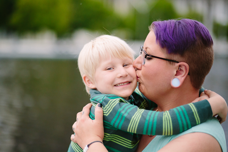 Mom kissing sons cheek