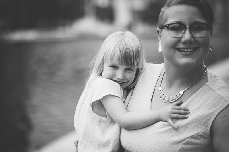mom holding daughter black and white portrait