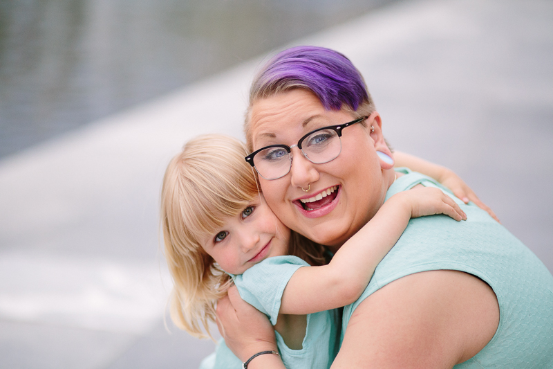 mom hugging young daughter