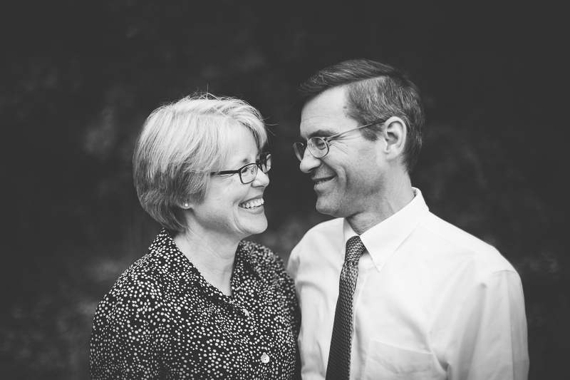 husband and wife smiling at each other