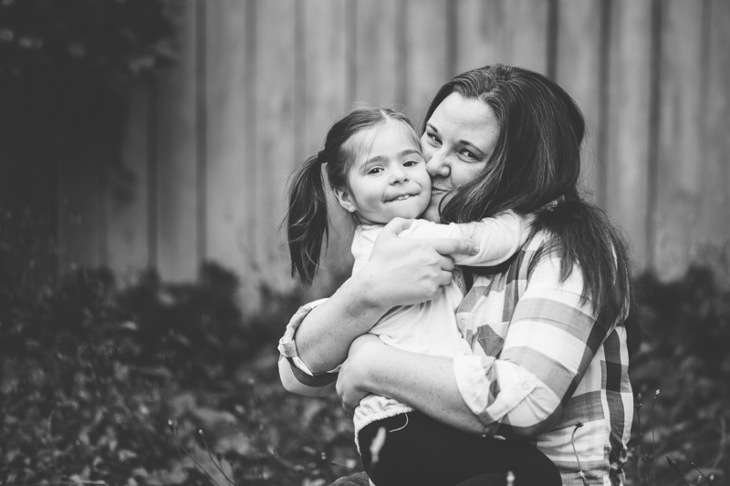 mom hugging daughter
