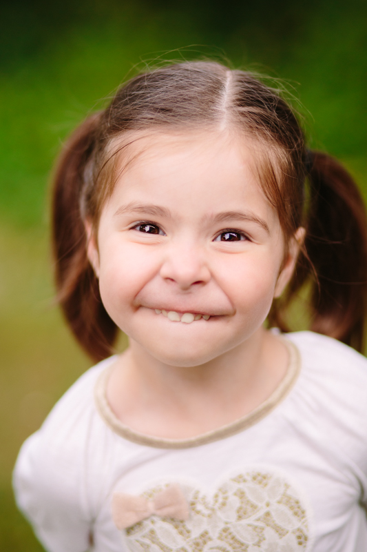 little girl making a funny face 