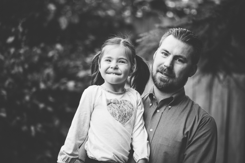 Dad with young daughter making a silly face