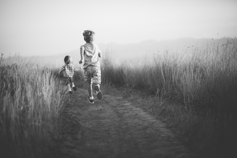 two boys running away on the Bonneville trail North Salt Lake