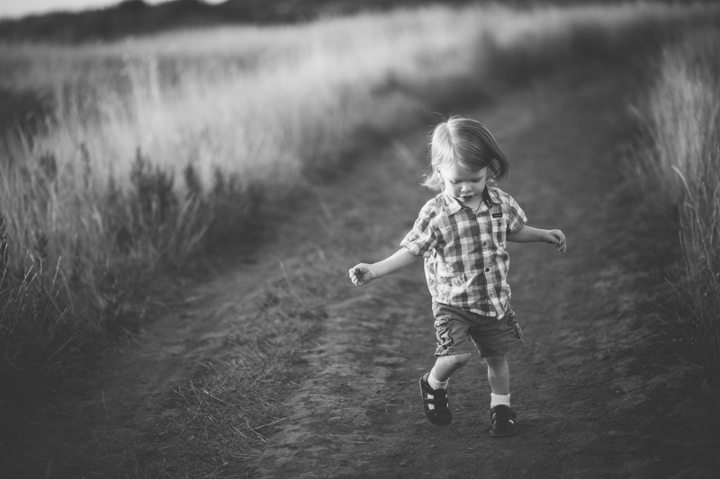 Toddler running on a trail in North Salt Lake mountain