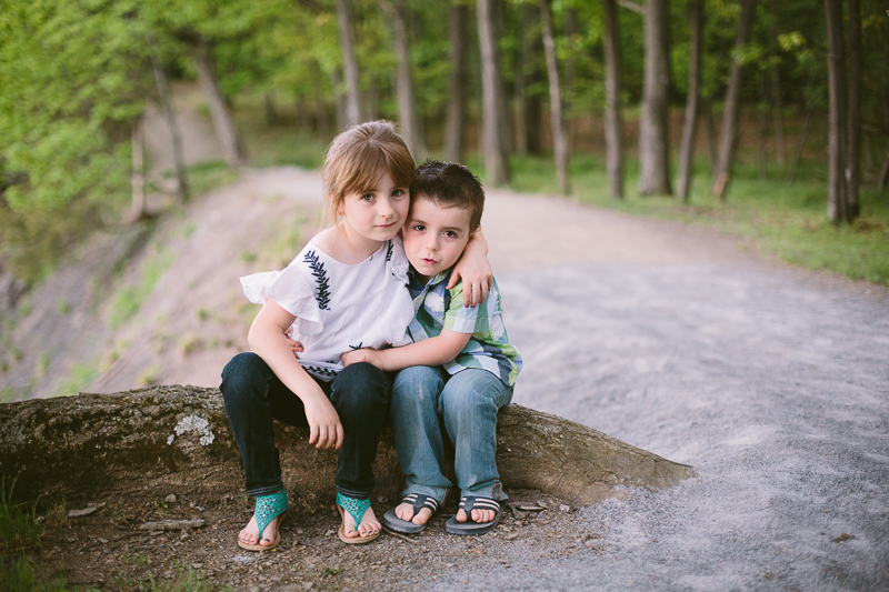 two children sitting on a log at Peebles State Park