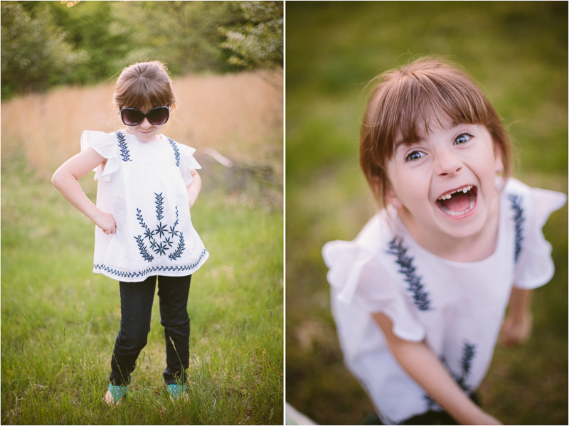 Little girl wearing sunglass and laughing