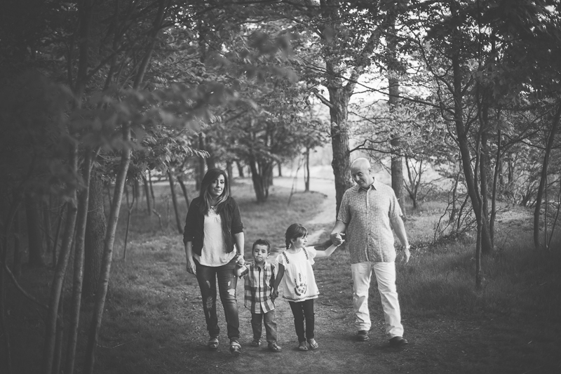 Black and white portrait of family walking together