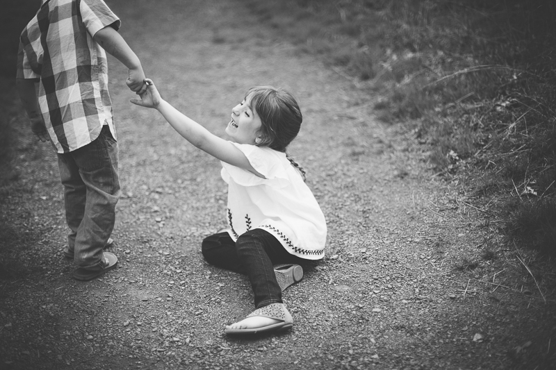 holding hands with brother smiling black and white