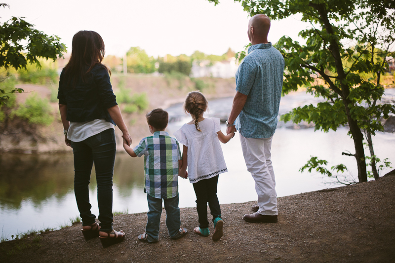 Family looking at river and waterfall 
