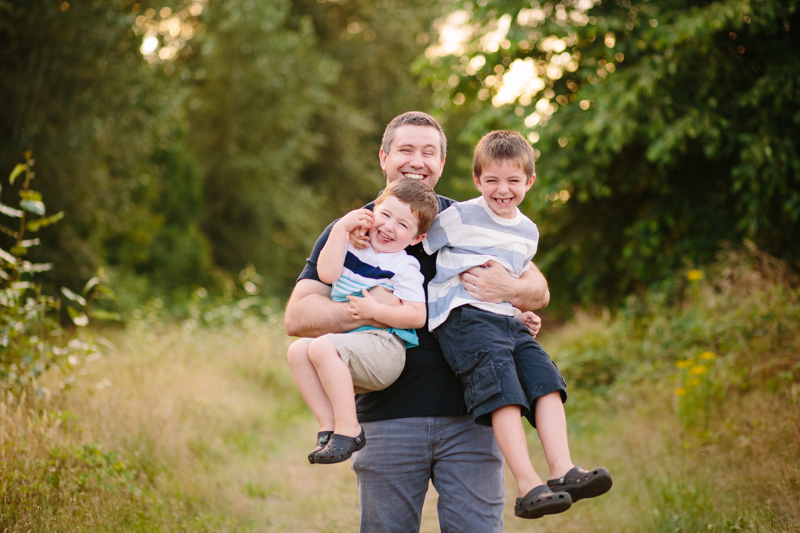 dad hugging his two boys