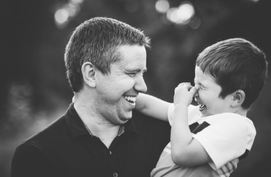 dad and son laughing