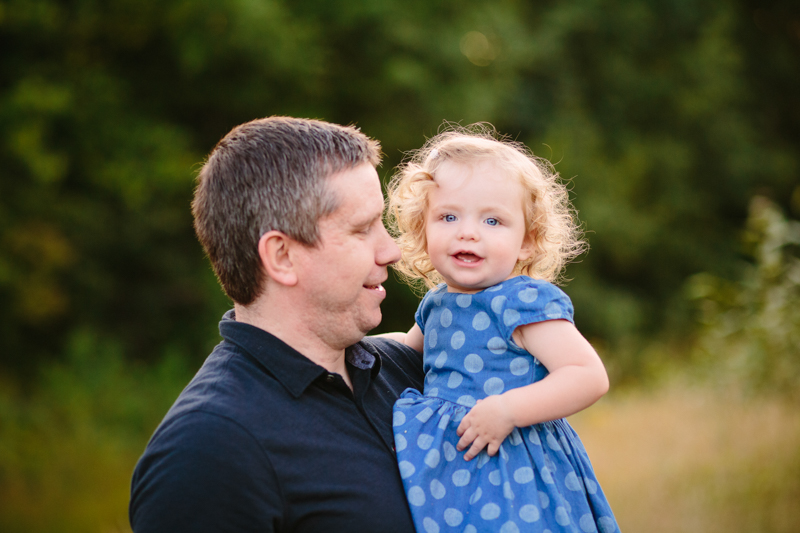 dad looking at young daughter