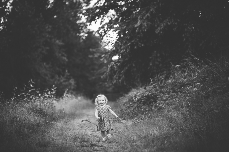 little girl running on a trail