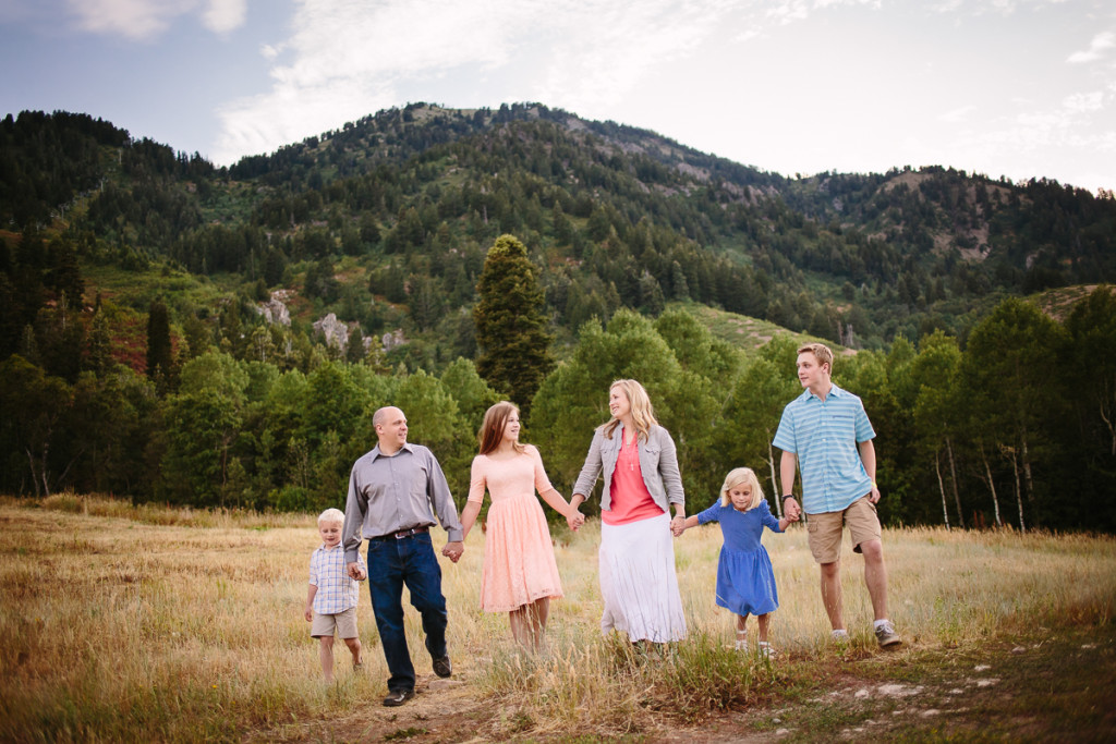family holding hands talking