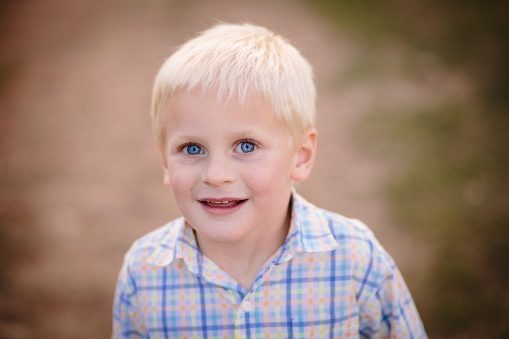 close up of boy with blonde hair and blue eyes