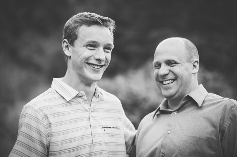 dad laughing with his taller son