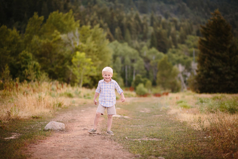 little boy running on trail