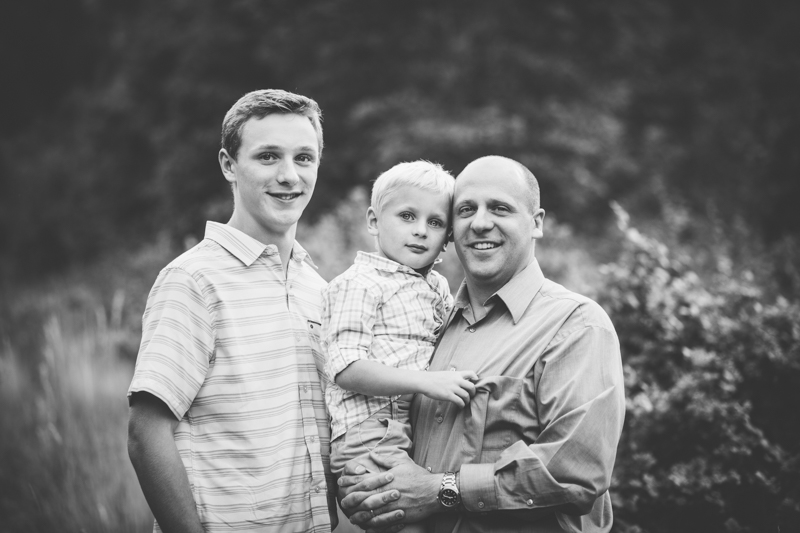 black and white portrait with dad and two sons