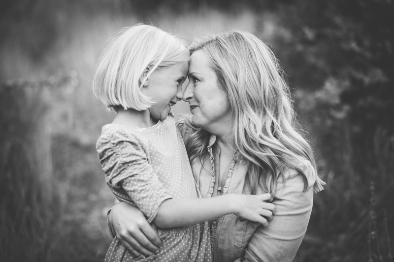 mom looking at daughter foreheads touching