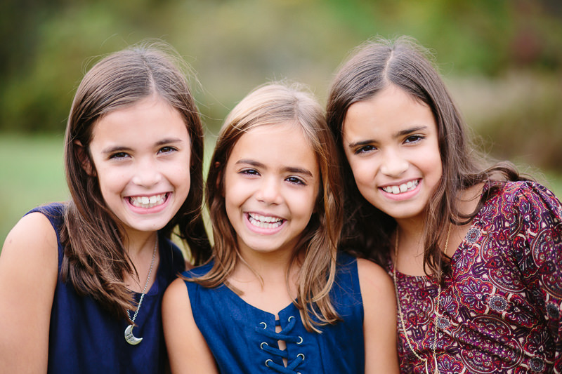 close up of three girls with dark hair