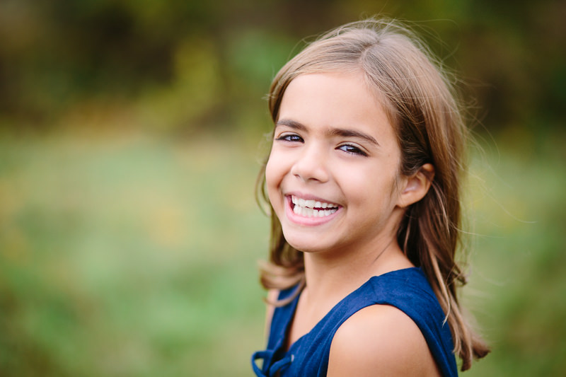 girl with brown hair wearing blue