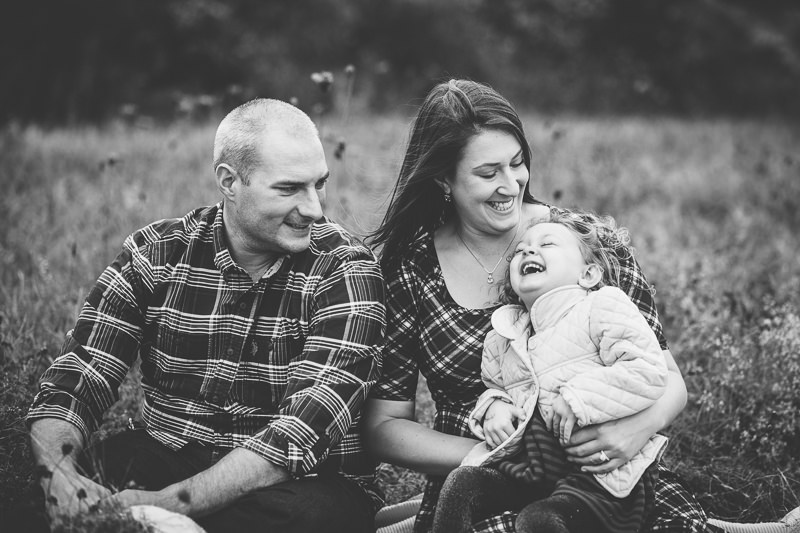 tickling daughter during family pictures