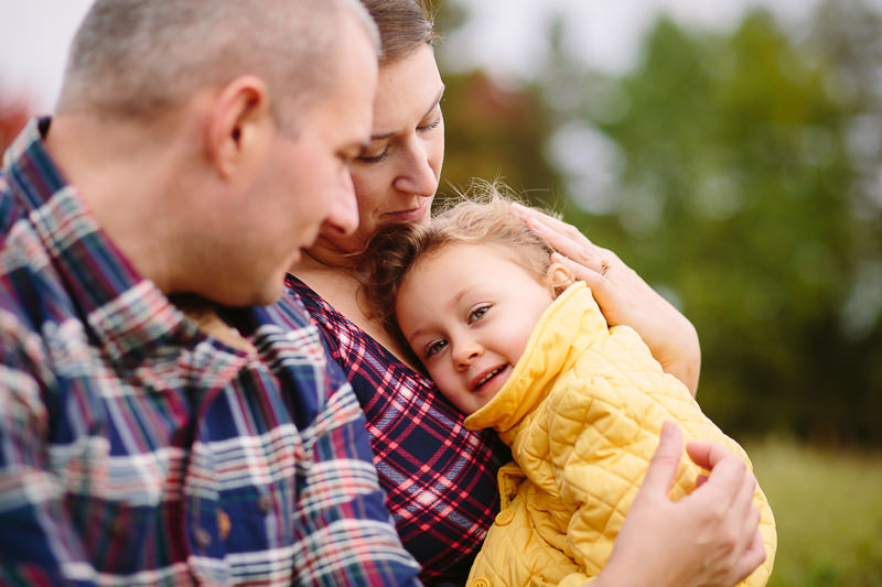 little girl laying on moms chest