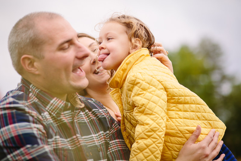 little girl about to lick her dad