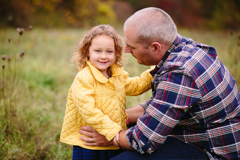 dad talking to daughter in yellow jacket