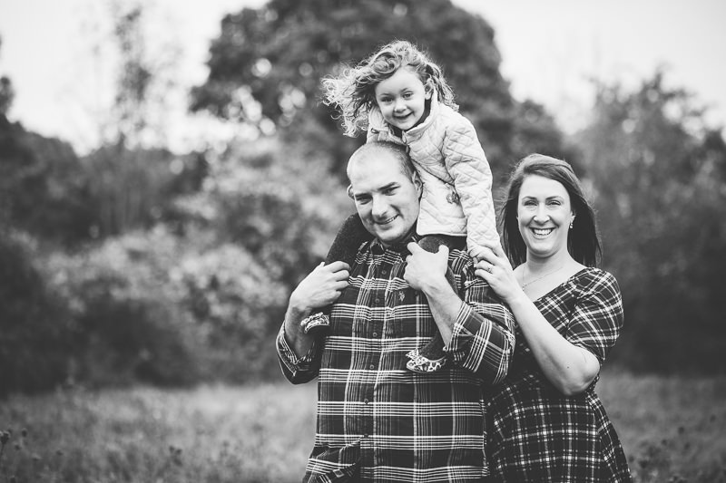 family picture girl on dad shoulders