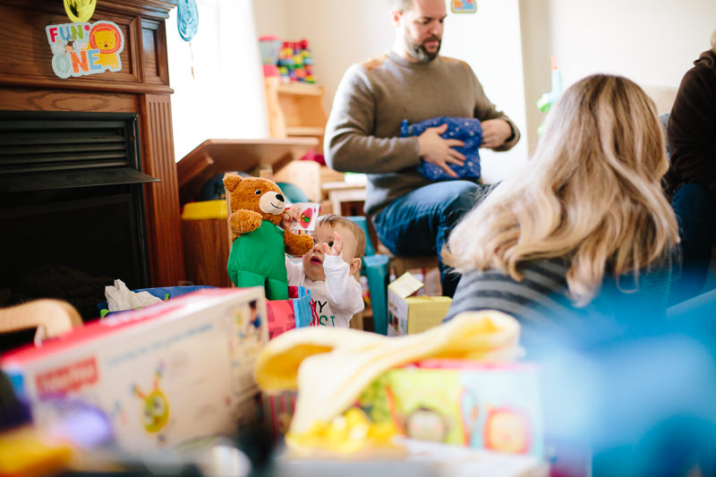 baby boy pulls out stuffed animal present