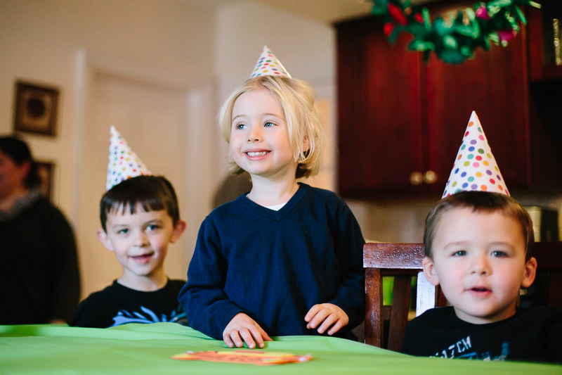 young boys wearing birthday hats