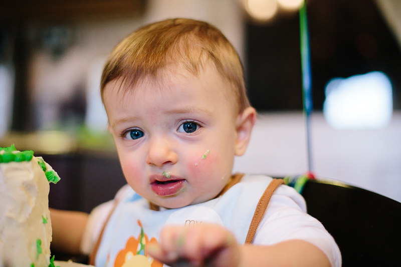 baby boy with cake on his face